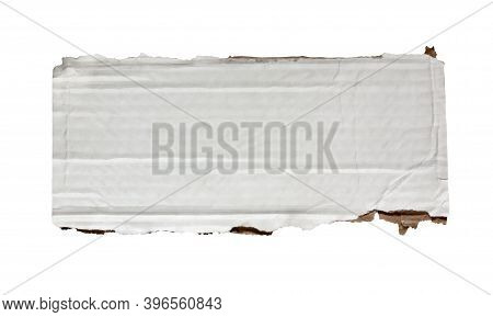 One Piece Of Cardboard Isolated On A White Background. White Corrugated Cardboard With Ragged Edges 