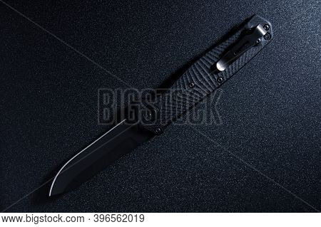 The Reverse Side Of The Pocket Knife Is Black. Knife With Clip For Carrying. Top.