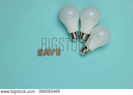 Eco Three Led Light Bulbs On Blue Background. Top View