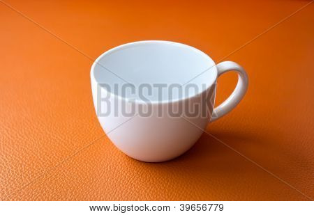 White Cup On Orange Background