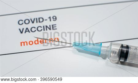 Covid-19 Vaccine From Moderna Company With A Syringe On A White Background, Denmark, November 24, 20