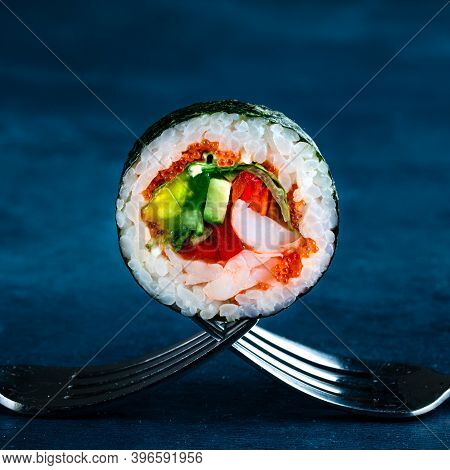 Traditional Japanese Futomaki Roll Stuffed With Tobiko Caviar, Cucumber, Crab Meat And Tomato, Futom