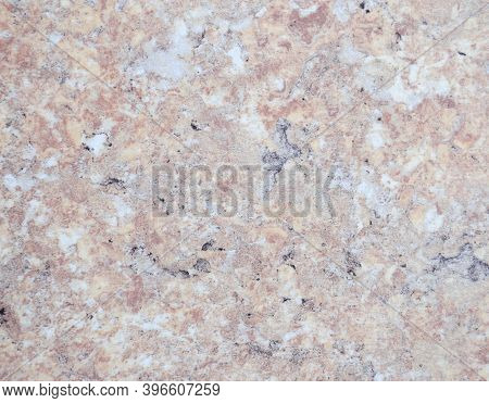 Pale Pink Marble Interspersed With Black And Gray Colors, Close-up Of A Smooth Polished Natural Ston