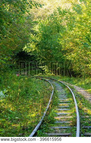 Abandoned Railway In Autumn Mountain Forest With Foliar Trees In Caucasus, Mezmay.