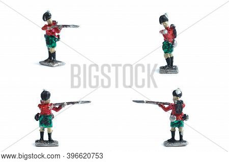 4 In 1 Shot Of Handmade Tin Soldiers With Musket On The White Background