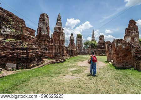 Girl Exploring Ayutthaya Historical Park In Thailand