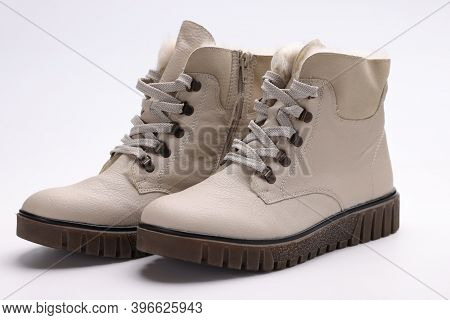 Beige Winter Boots With Thick Soles. Fashion Trends In The Shoe Industry Concept