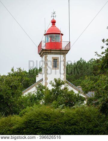 The Lighthouse Of Morgat (brittany, France) On A Cloudy Day In Late Summer