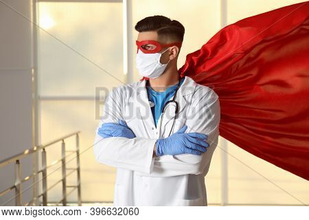 Doctor Wearing Face Mask And Cape Indoors. Super Hero Power For Medicine