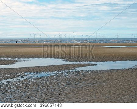 The Beach At Blundell Flats In Sefton, Southport With Pools On The Beach The Beach And The Wind Turb