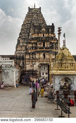 Hampi, Karnataka, India - November 4, 2013: Virupaksha Temple Complex. People In Colorful Dresses In