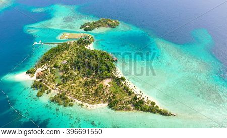 Aerial Drone Of Seascape With Beautiful Beach And Tropical Malipano Island With Palm Trees By Coral 