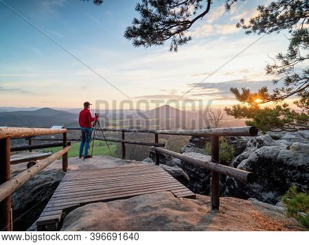 Man Set Camera And Tripod For Landcape Photography On Vilemina Platform View. Popular Tourist Trip D