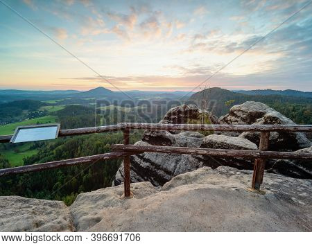 Tourist View Platform With Engraved Map On Vilemina Rock. Popular View Point Above Forest Landscape 