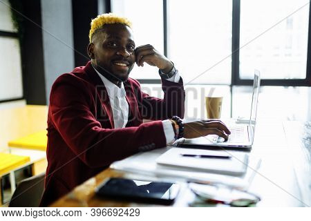 African American Man Getting Online Education And Drinks Coffee To Go Frop Paper Eco Cup