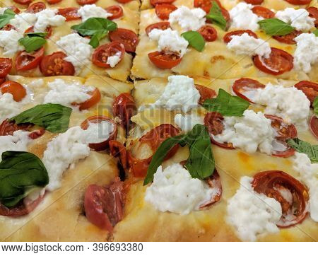 Closeup Of Traditional Italian Pizza By The Slice (pizza Al Taglio) With Cherry Tomatoes, Fresh Buff