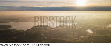 Aerial View From Above Of A Countryside Landscape With Beautiful Sunset Light On A Winter Evening Wi