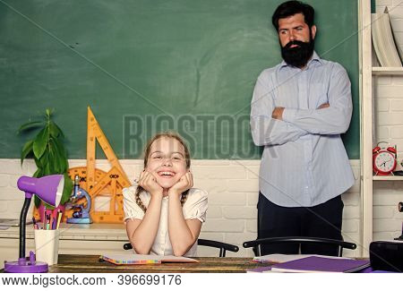 Homeschooling With Father. Pedagogue Skills. School Teacher And Schoolgirl. Work Together To Accompl