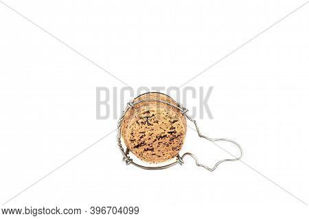 Back Side Of A Champagne Cork With Muselet On A White Background. Close Up. Copy Space.
