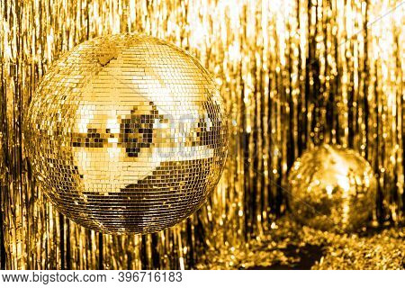Festive Background. Disco Ball On Beige And Fortuna Gold Background. Christmas. Wedding. Birthday. C