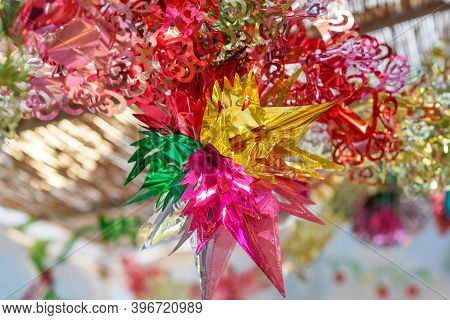 Colorful Festive Decoration Shiny Garland At Sunset Light.