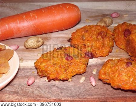 The Process Of Making Carrot Cookies With The Addition Of Dried Apricots, Peanuts And Sunflower Seed