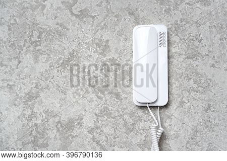 Door Audio Intercom On The Wall. Background With Copy Space.