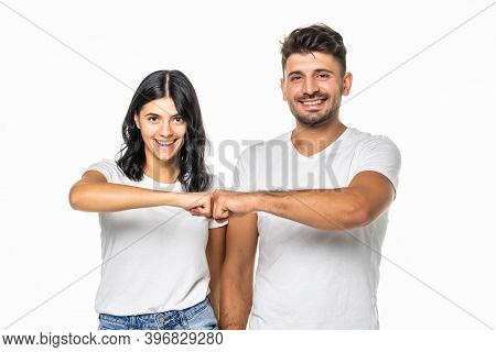 Relationships, Friendship And People Concept - Portrait Of Happy Couple In White T-shirts Making Fis