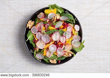 Fresh Salad With Pomegranat, Oranges, Onion, Nuts, Spinach, Radish