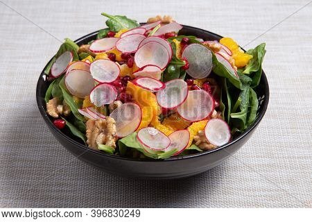 Fresh Salad With Pomegranat, Oranges, Onion, Nuts, Spinach, Radish