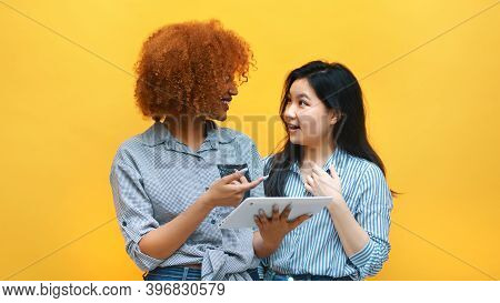 Young Multiracial Friends Browsing Social Media Online With Excited Face Expressions. Afican America