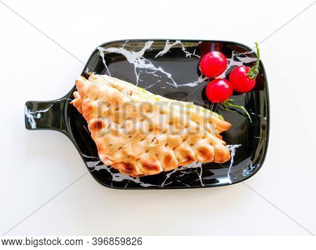 Whole-meal bread sandwich topped with Lyon rosette and butter