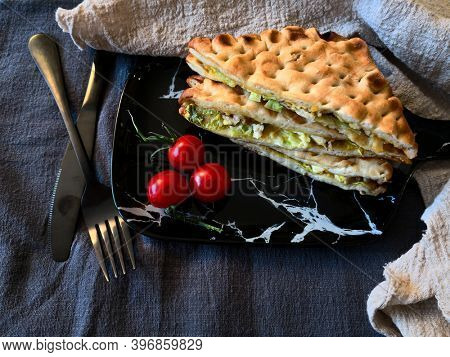 Whole-meal bread sandwich topped with Lyon rosette and butter