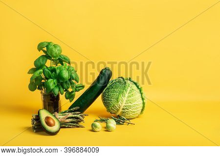 Abstract Composition With Fresh Vegetables Of Cabbage, Zucchini, Asparagus, Brussels Sprouts, Avocad