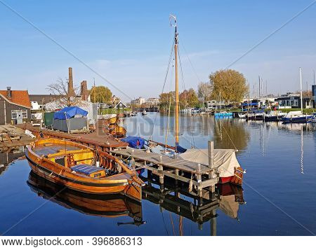 Harbor from Huizen with old fashioned sailing boats in the Netherlands