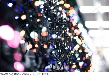 Christmas Light Garlands In The Supermarket, Blurred Photo
