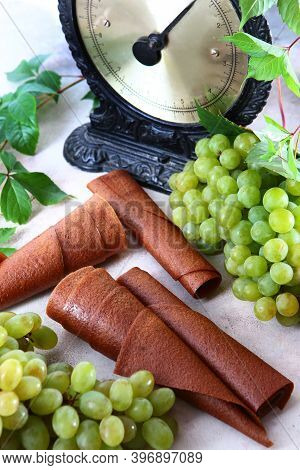 Natural Light Grape Marshmallow Is Rolled Into A Tube. Natural Bioproduct Without Preservatives. Vin