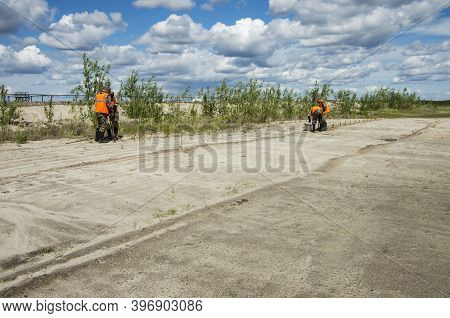 Khanty-mansi Autonomous Okrug, Russia / 12.06.2015: Reclamation Of An Oil Production Site. Planting 
