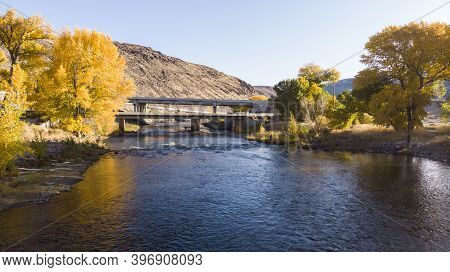 Drone Point Of View Over The Truckee River As It Passes Under Bridges Near Highway I80