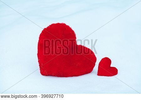 Two Hearts Big And Snall On The Snow