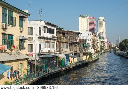 Bangkok, Thailand - December 7, 2019: Street View Of Bangkok At Day With Old Residential Buildings A