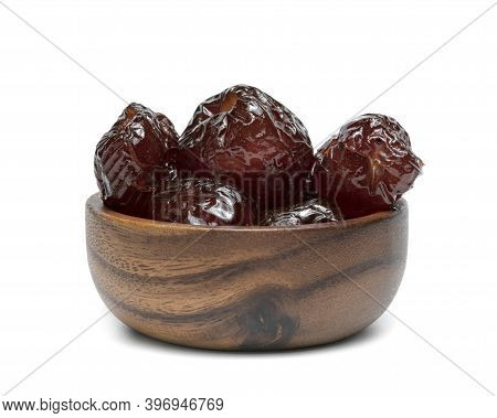Chinese Date Or Jujube Or Monkey Apple In Syrup With Wooden Bowl Isolated On White Background