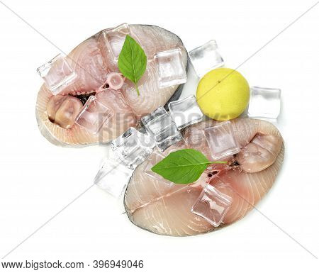 Spanish Mackerel Slice Or Spotted Mackerels With Lemon And Leaf Basil And Ice Cube Isolated On White