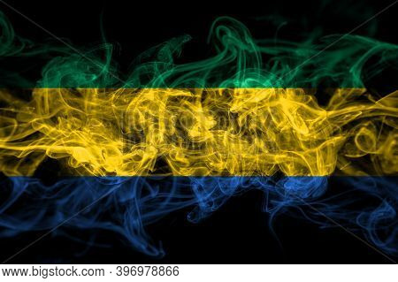 Gabon, Gabonese, Gabonian Smoke Flag Isolated On Black Background