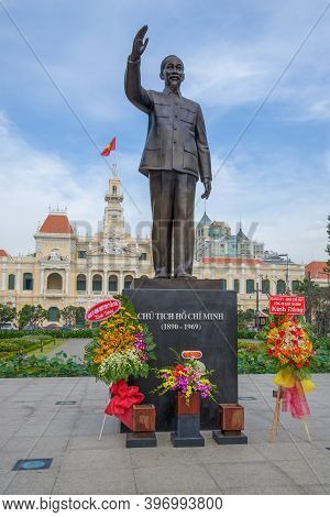 Hochimin, Vietnam - Dec 19, 2015: Monument To Ho Chi Minh In Front Of The City Council Building (tow