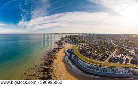 Drone aerial view of the beach and white cliffs on sunny day, Margate, England, UK