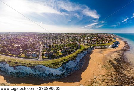 Drone aerial view of the beach and white cliffs on sunny day, Margate, England, UK