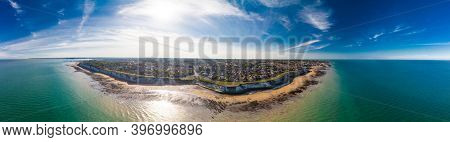 Drone aerial view of the beach and white cliffs on sunny day, Margate, England, UK