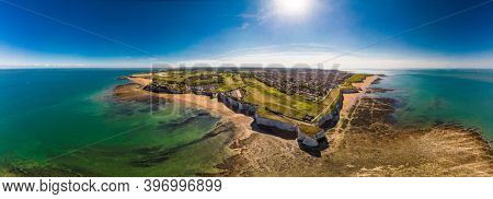 Drone aerial view of the beach and white cliffs on sunny day, Margate, England, UK