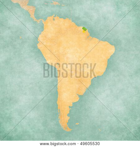 French Guiana (Flag of the department) on the map of South America. The Map is in vintage summer style and sunny mood. The map has a soft grunge and vintage atmosphere which acts as a watercolor painting.